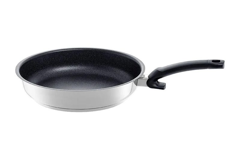 Fissler Adamant Premium frying pan with a black non-stick coating, polished steel outside and black handle