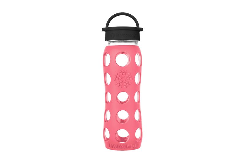 Lifefactory 22 oz glass water bottle in a coral silicone sleeve with a black screw cap